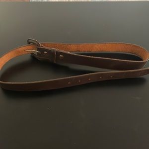 Like new belt, measures 35.5 inches to center hole from fold.